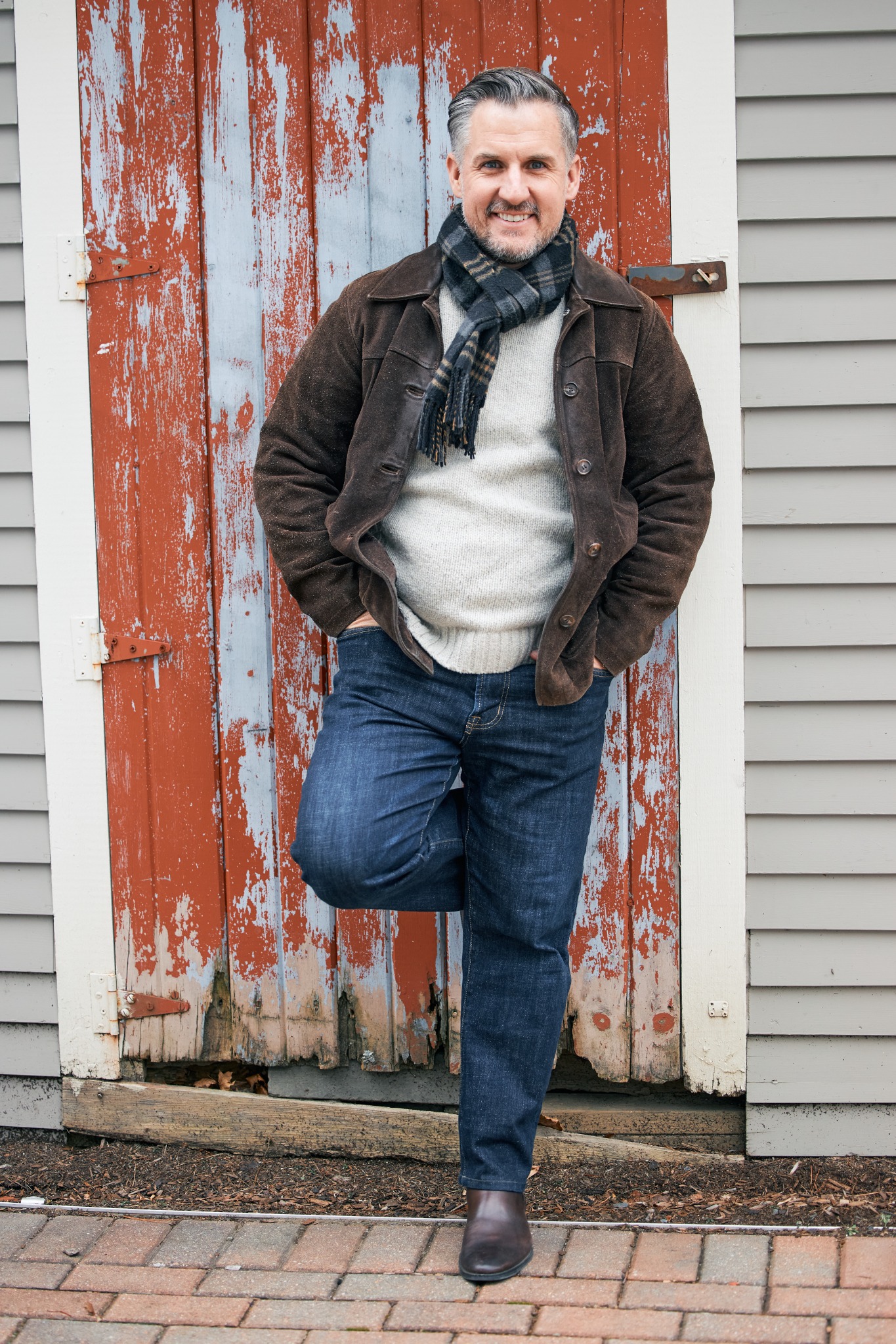Matthew Blanchette standing in front of a historic red door