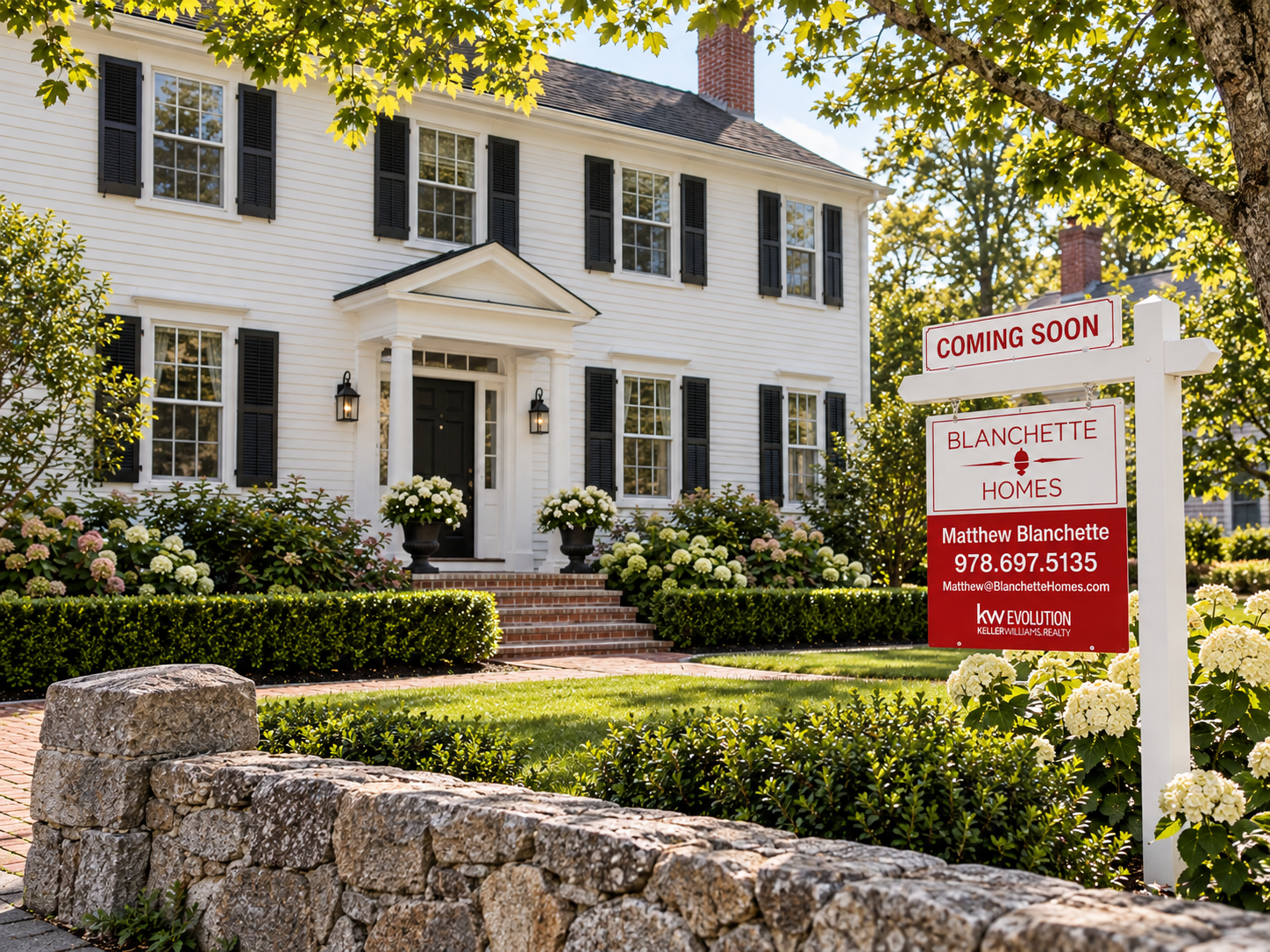 New England home with a Blanchette Homes Coming Soon sign